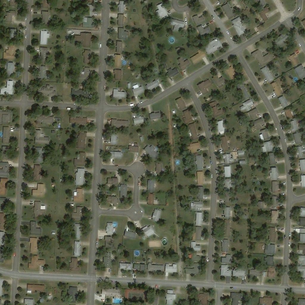 Satellite tile of a residential neighbourhood before a hurricane